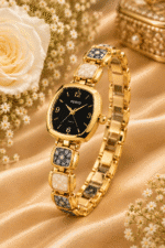 Angled view of gold-tone black dial bracelet watch with cream and grey patterned links