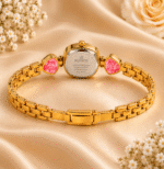 Back view of gold-tone bracelet watch showing case back and bracelet clasp